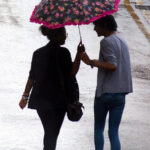 1024px-Couple_sharing_an_umbrella_in_Nottingham,_England