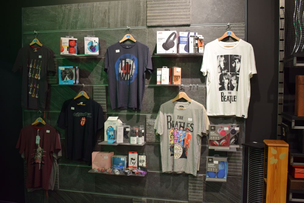 T Shirts and merchandise hanging in Off the Record