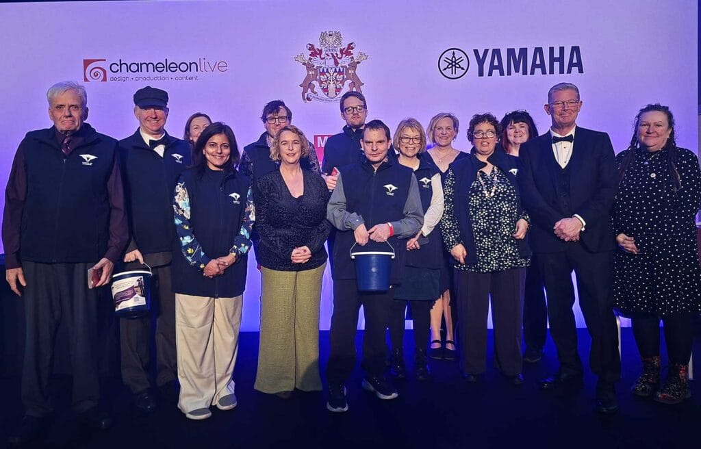 Camphill MK team on stage at Milton Keynes charity event during mayoral year
