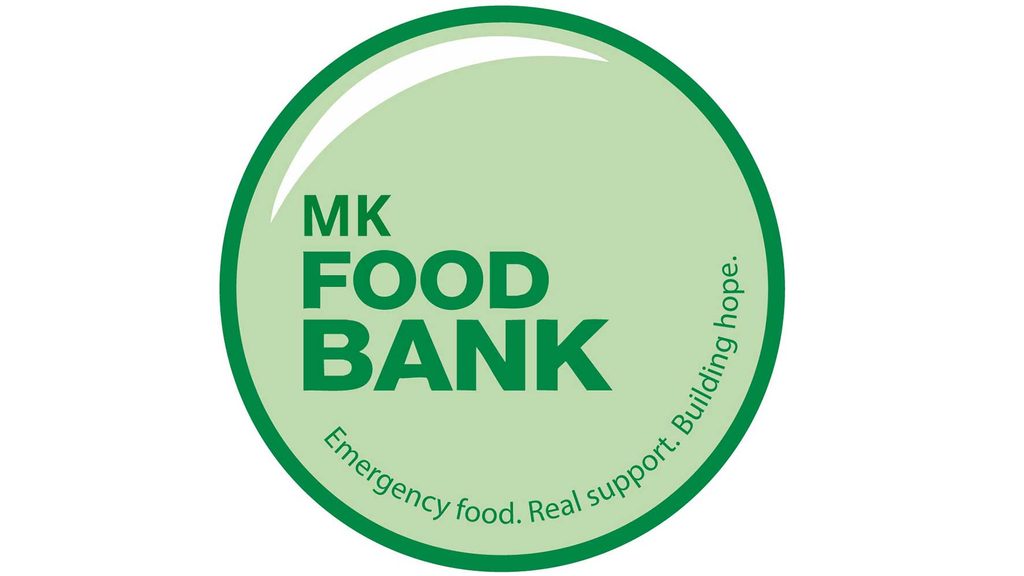 Logo: MK Food Bank circular badge with green border and inside text 'MK FOOD BANK' and curved slogan 'Emergency food. Real support. Building hope.'